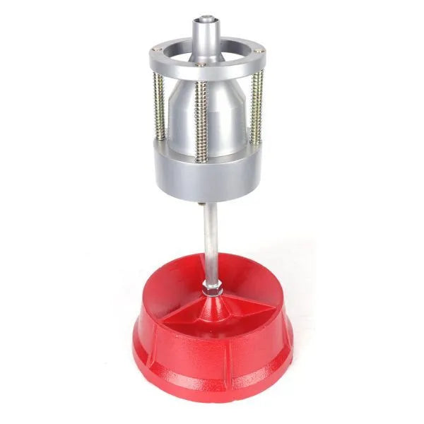 Portable hub balancer tool with aluminium head and enamel-finished base for wheel balancing.