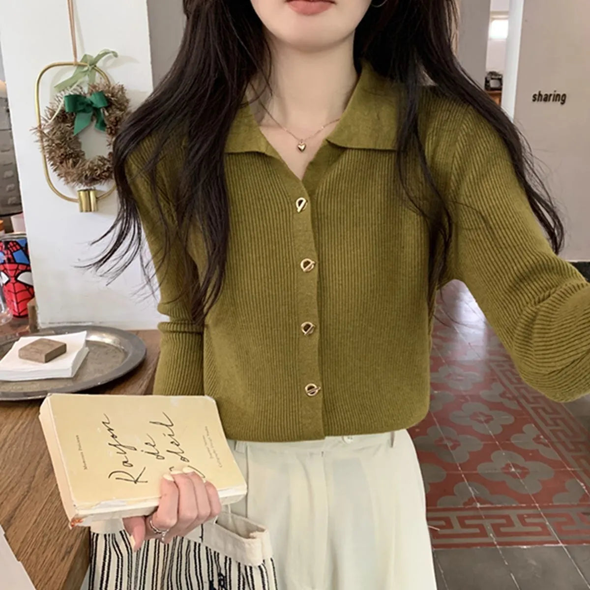 Women's beige loose-fit viscose knitted cardigan top with long sleeves shown worn open.