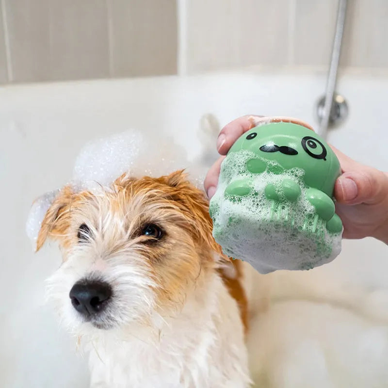 Silicone pet bath brush with body wash dispenser for dogs and cats, shown in green and purple