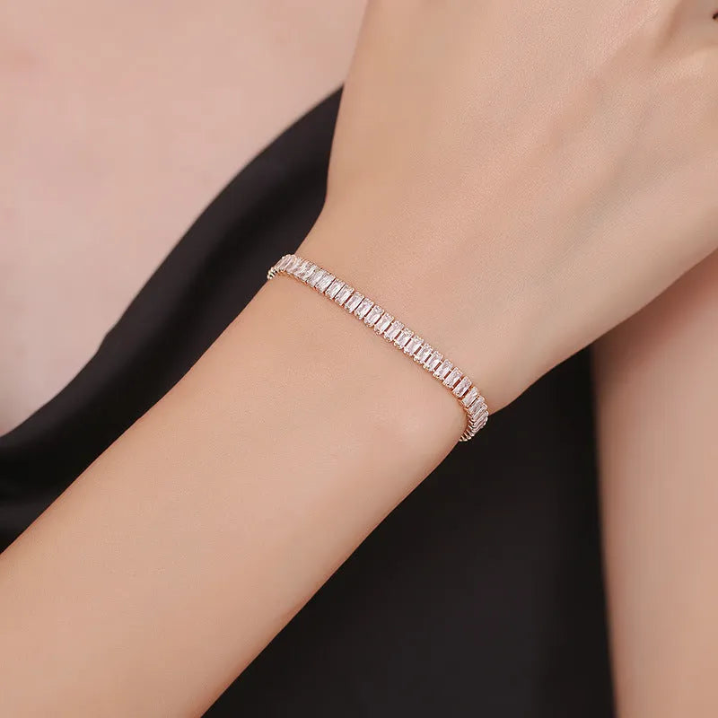 Women's brass bracelet with zircon inlaid geometric quadrilateral design in champagne gold finish