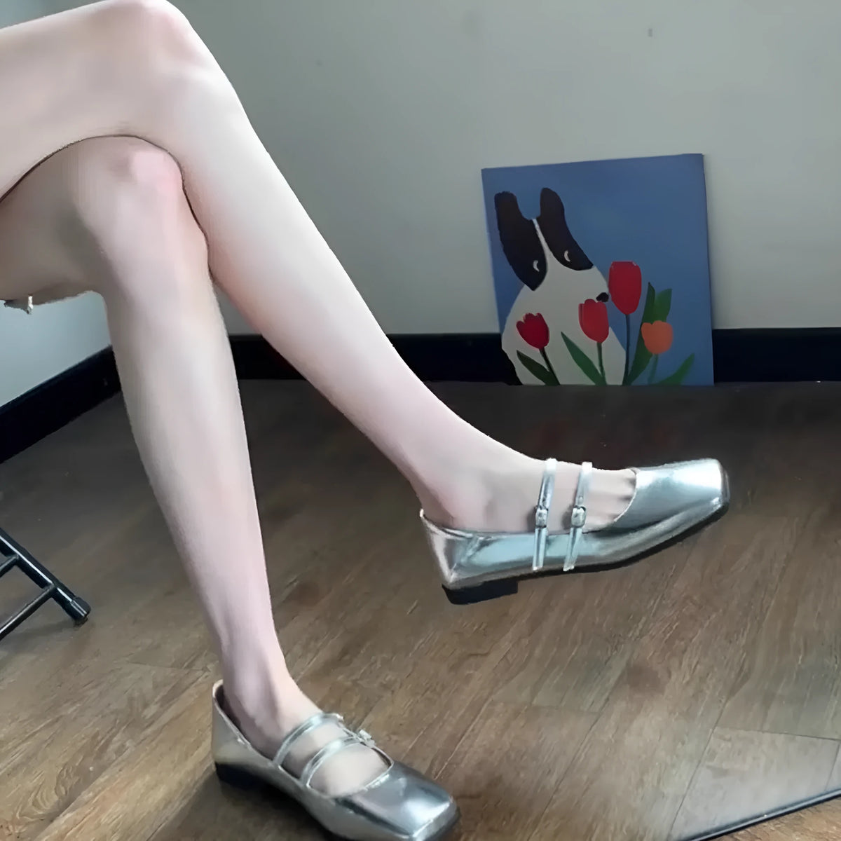 Women's silver genuine leather Mary Jane flats with a cross buckle strap and flat low heel.