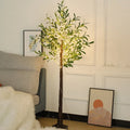 1.8 metre tall artificial olive leaf tree lamp with warm white LED lights illuminated in garden setting