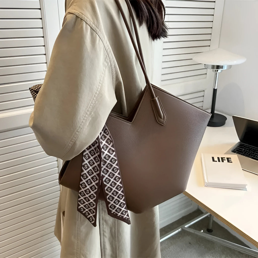 Women's black PU shoulder bag showing sandwich pocket compartments and 43cm width
