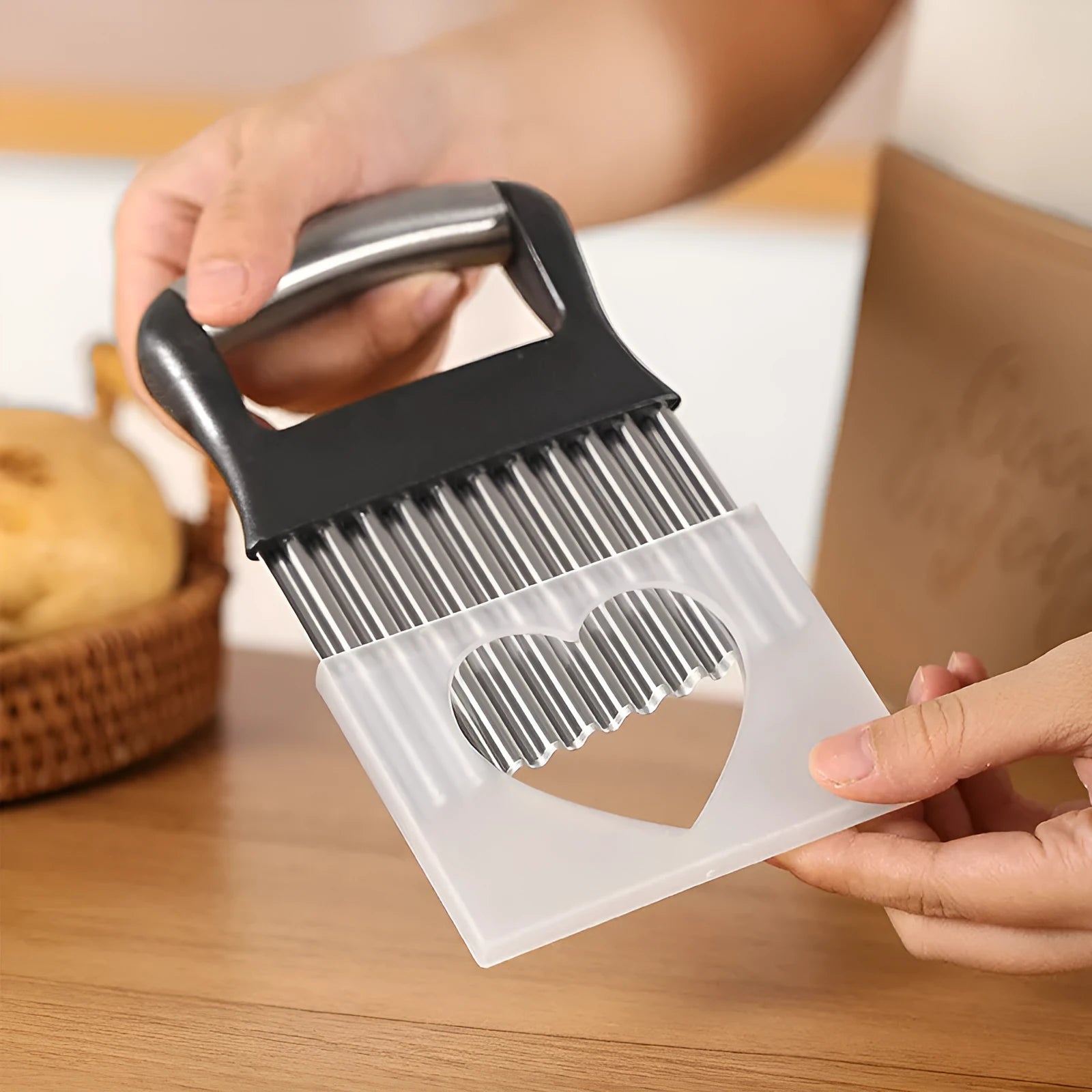 Stainless steel potato wave knife with wavy cutting blade on a chopping board.
