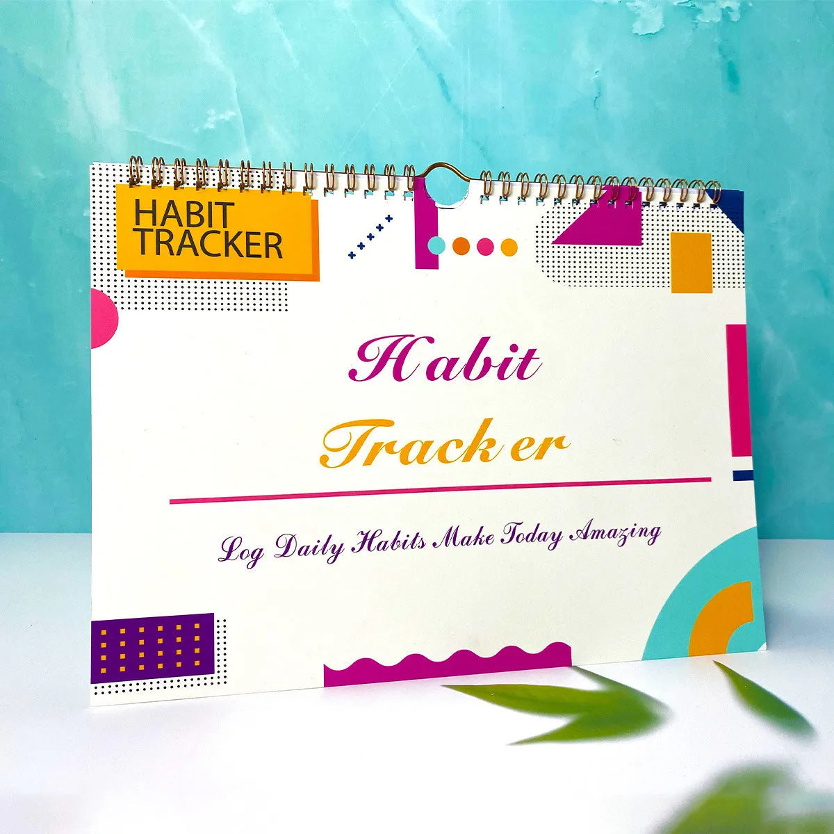 Habit tracking notebook open showing internal pages with 21x28cm dimensions in flower white cover colour