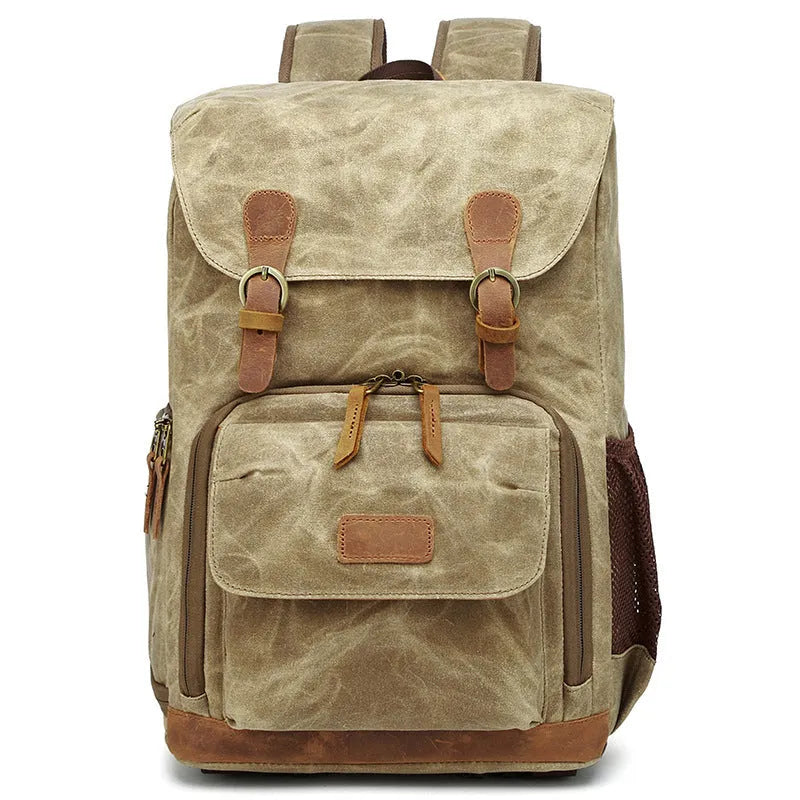 Khaki coloured canvas DSLR camera backpack with adjustable straps shown front-on.