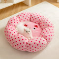 Pink dot fabric cat bed cushion shown in two size options for pets up to 20 pounds