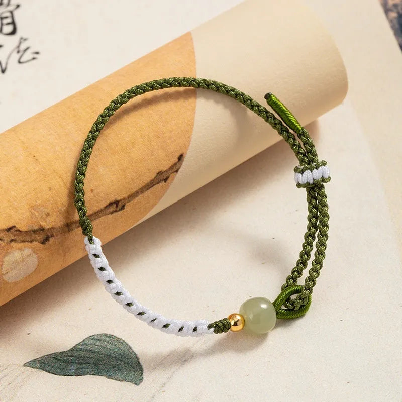 Hetian jade bracelet with sterling silver carrying strap on cord band in national fashion style