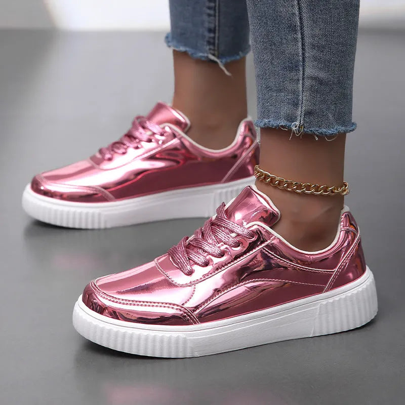 Rose gold sequin platform sneaker with thick sole and round toe on a white background.