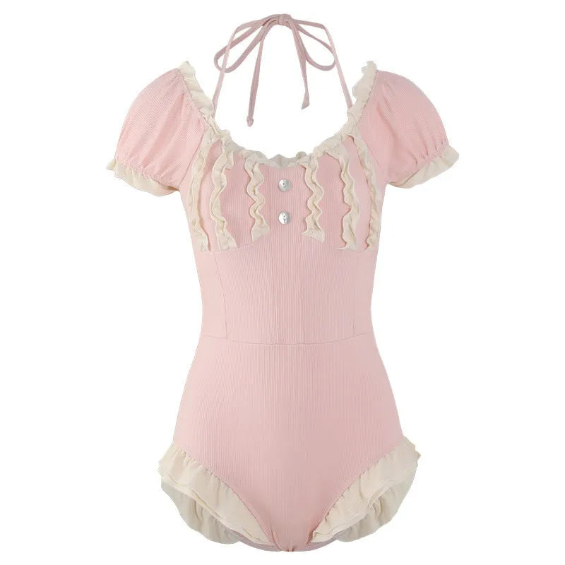 Women's pink conservative one-piece swimsuit with Siamese detailing in nylon fabric