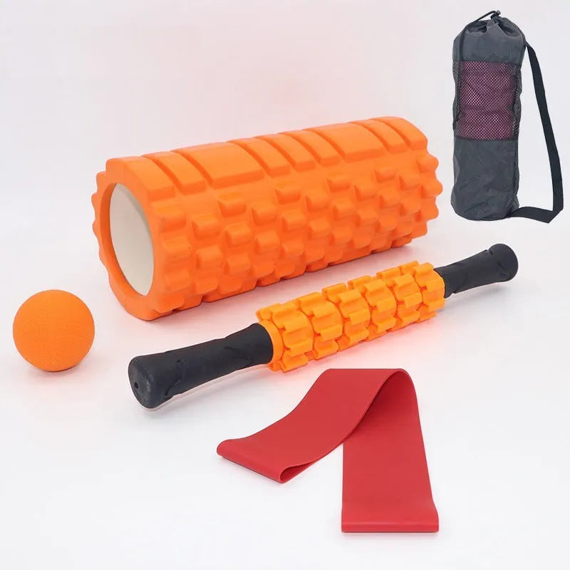 Black foam fitness roller with six-piece gear design, 33cm length, for massage and recovery.