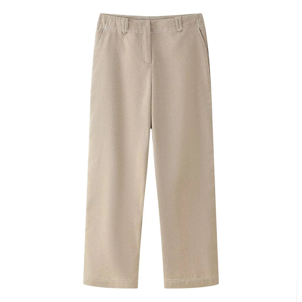 Women's light coloured herringbone pattern summer suit with jacket and straight-leg trousers, showing 3D pattern effect and embroidery details.