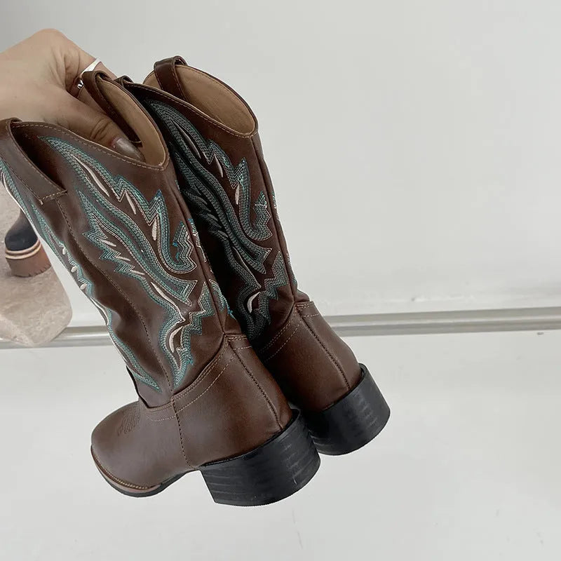 Brown women's embroidered leather Martin boots with a low square heel and mid-calf design.
