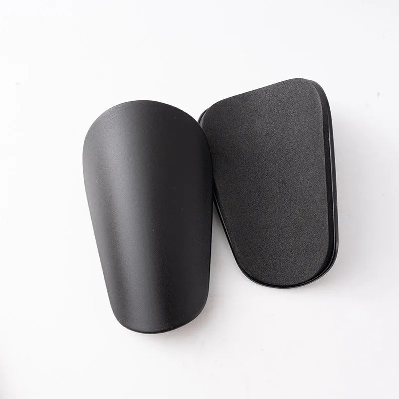 PU mini shin guards for football and sports protection in black, white, red, and blue colours