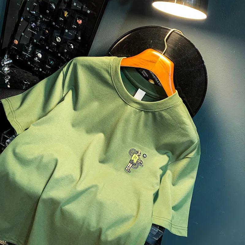 Green men's loose fit t-shirt with a literary print on the front.