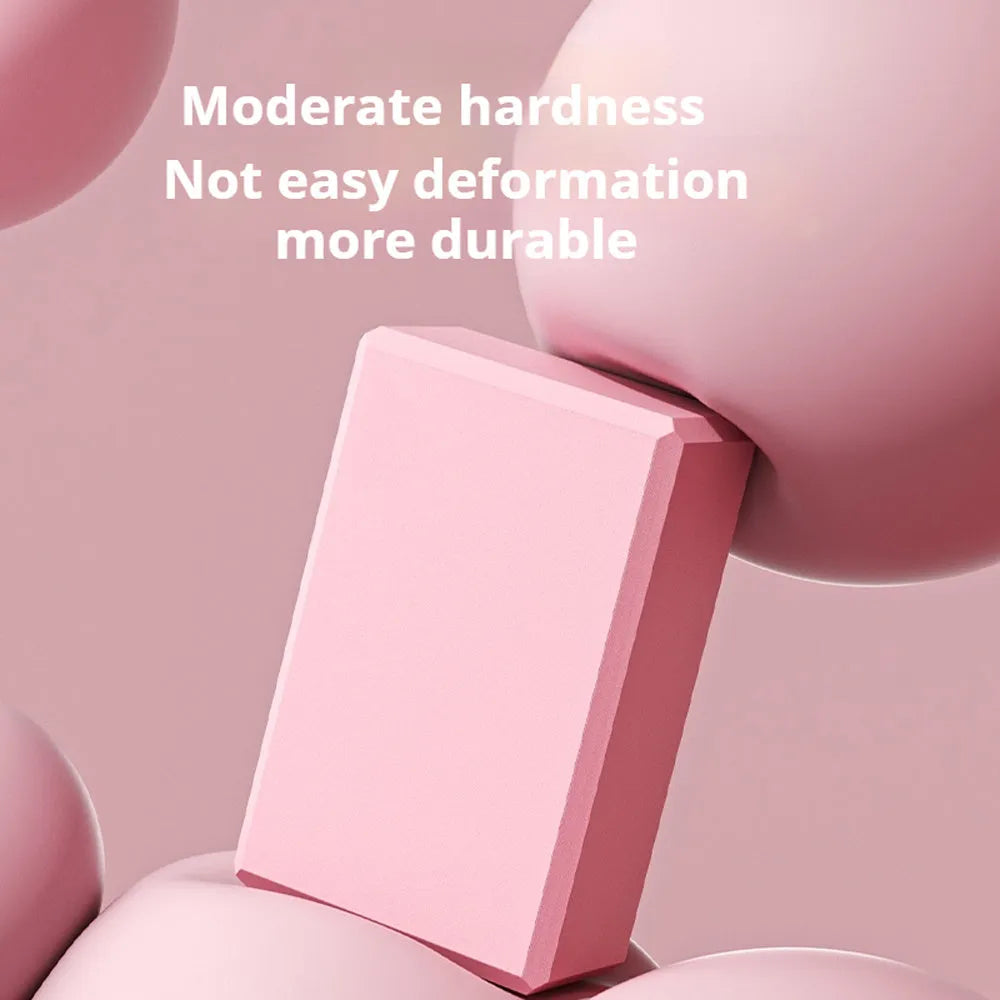 EVA foam yoga blocks in four colours showing hexagonal facets and ridge grip details