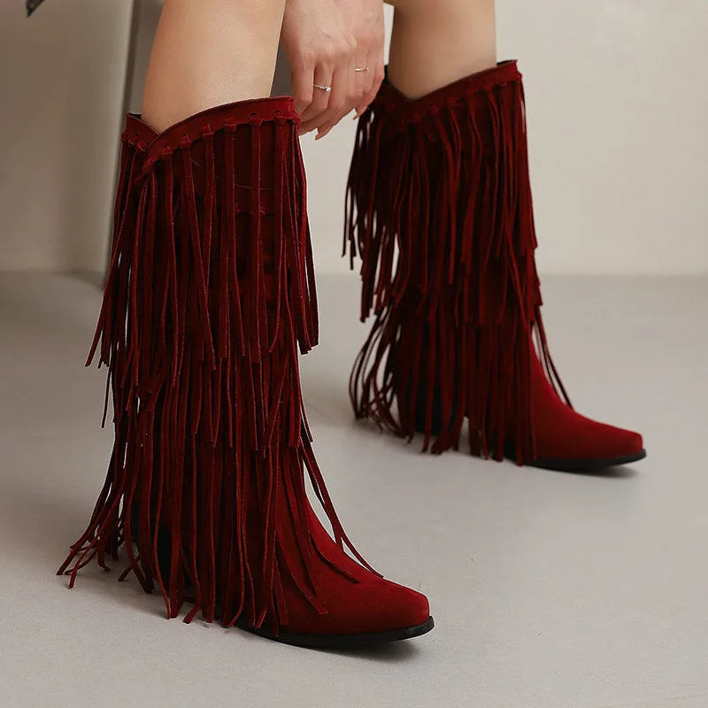 Women's suede high boots with tassels and a chunky heel in beige, shown from the side.