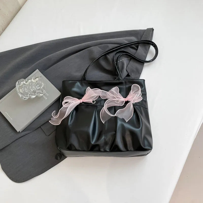College style bow tote bag in black with double shoulder straps and large capacity design