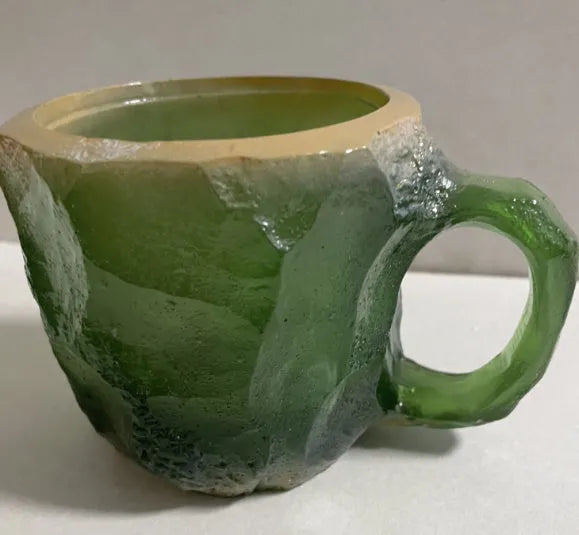 Resin mineral crystal coffee mug with handle in purple colour, showing 3D texture.