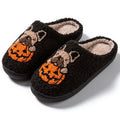 Black and white Halloween pumpkin slippers with plush cotton upper and non-slip rubber soles