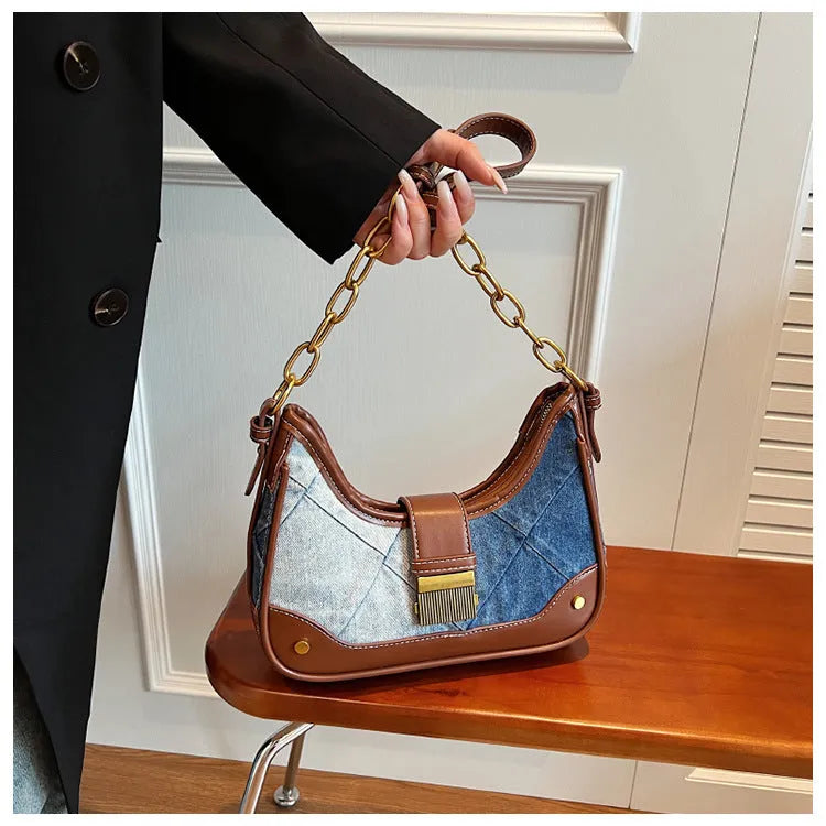 Brown denim women's shoulder bag with diamond mesh pattern and chain detail showing bucket shape