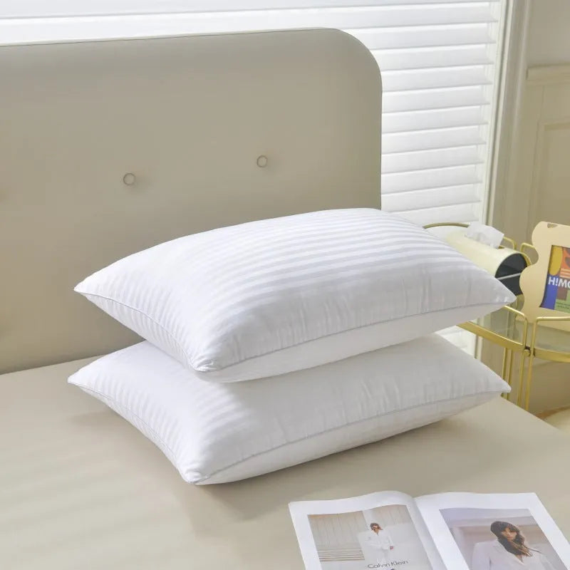 White cotton satin stripe pillow with feather and cotton filling, shown in low, medium, and high loft options.