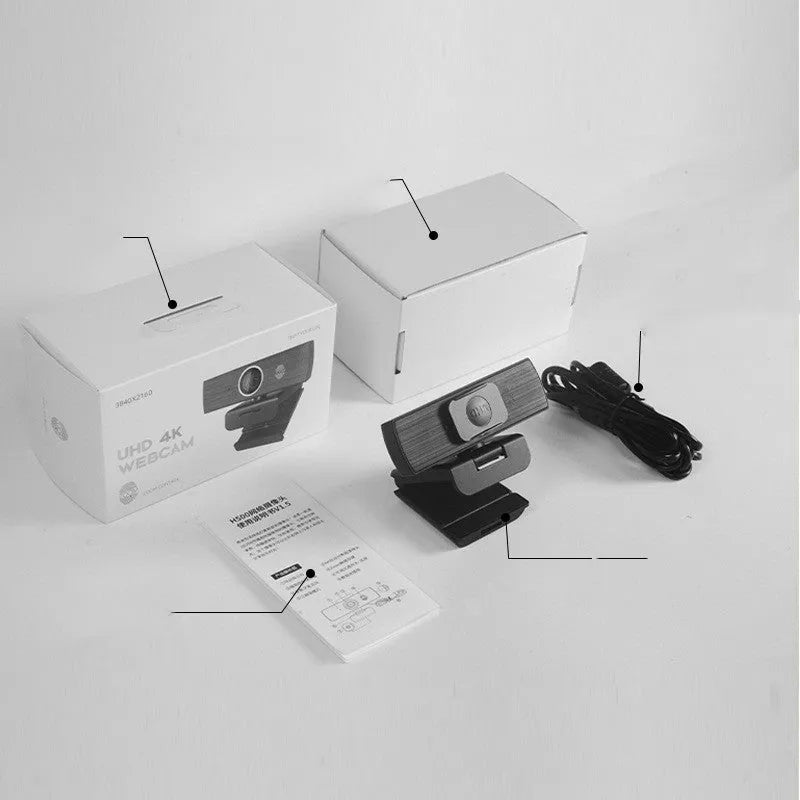 Black USB webcam with magnetic privacy cover on a laptop, showing 4K resolution and 60FPS specifications.