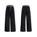 Drooping straight-leg trousers with button-open line design in black and grey colours