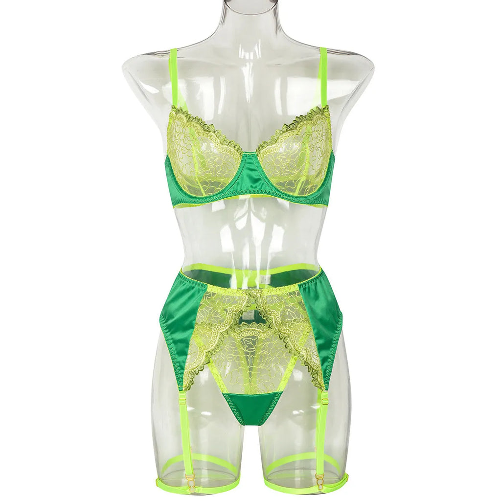 Green three-piece bikini set with flower embroidery, satin patchwork, and see-through colour contrast design.