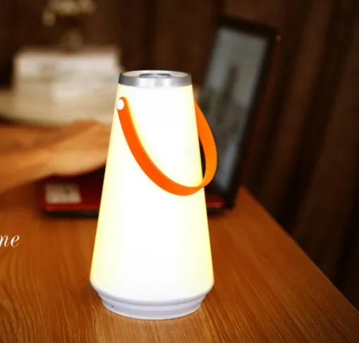 White rechargeable bedside table lamp with USB charging cable and touch control for adjustable brightness