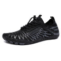 Men's white Upstream lace-up casual trainers with a rubber sole on a plain background.