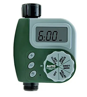 Green digital programmable water timer for garden hose with copper connector and LCD screen.