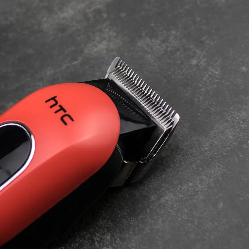 Professional cordless electric hair clipper with brushless motor and four comb attachments on a white background