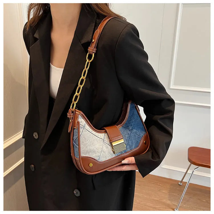 Brown denim women's shoulder bag with diamond mesh pattern and chain detail showing bucket shape