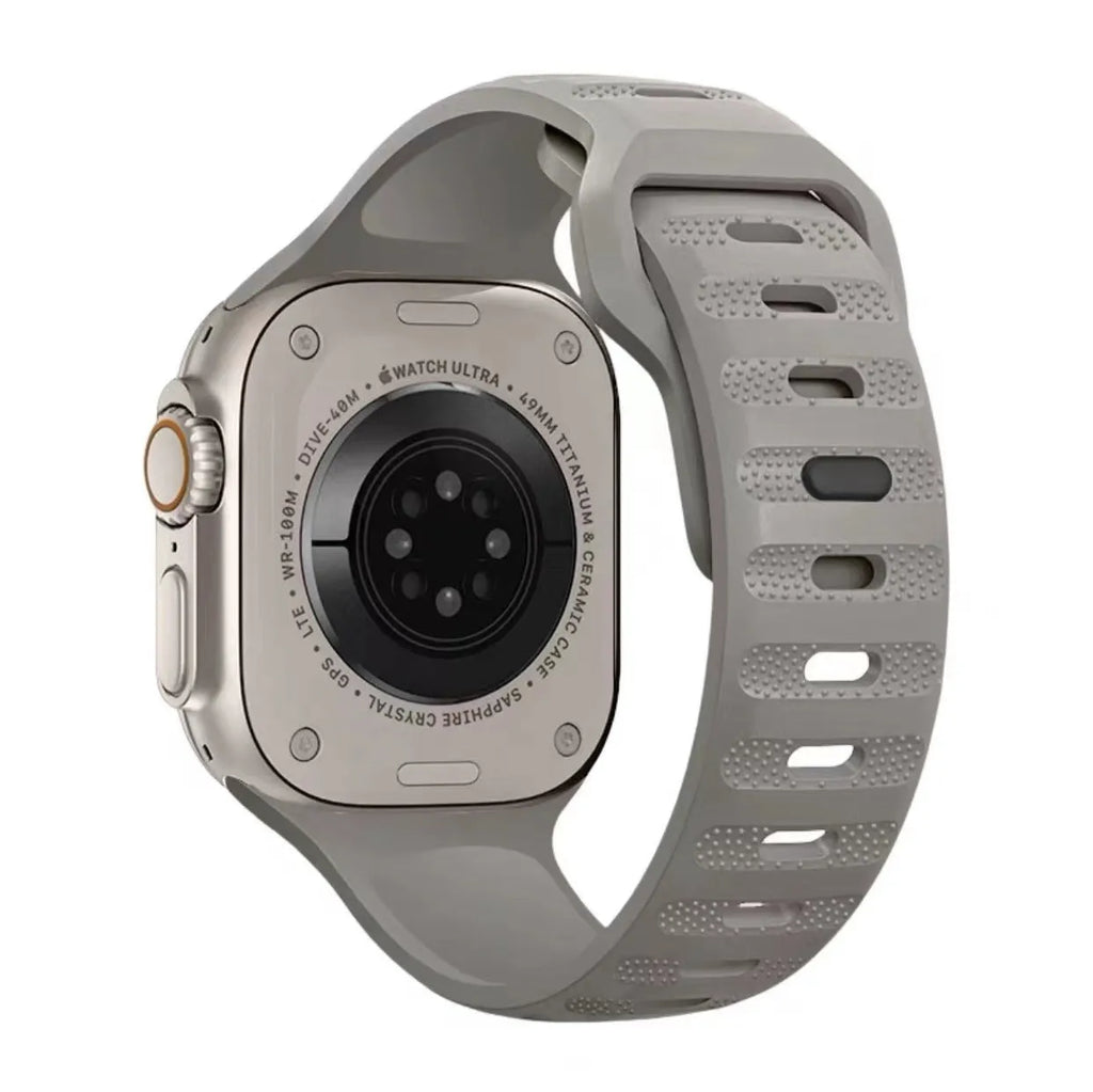 Fluoro rubber Apple Watch band in six colours with a T buckle, shown next to a smartwatch.