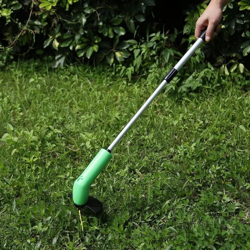 Cordless Zip Trim handheld lawn mower and weed trimmer with extension pole and debris shield.