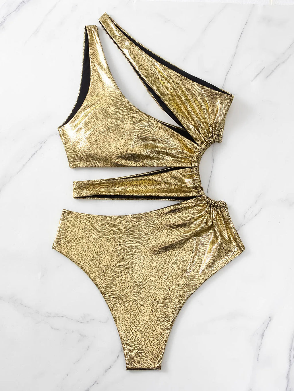 Gold women's one-piece swimsuit with backless design and sleeveless construction