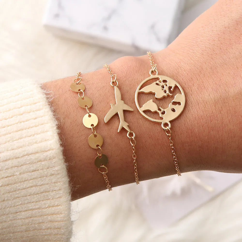 Three women's bracelets with heart-shaped aircraft map charms in bohemian style