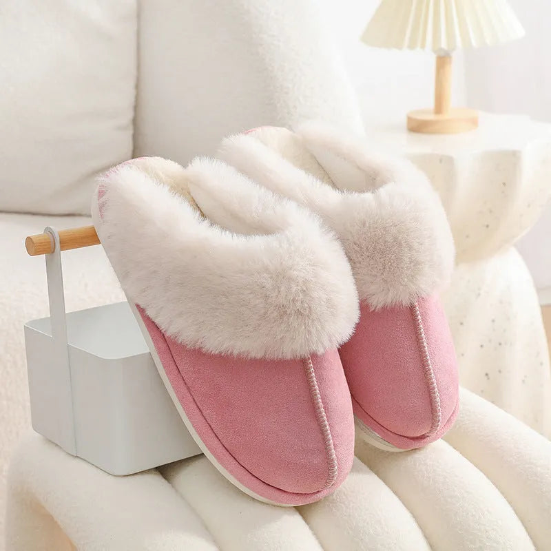 Women's plush winter slippers in pink with a round toe, flat heel, and anti-slip PVC sole.