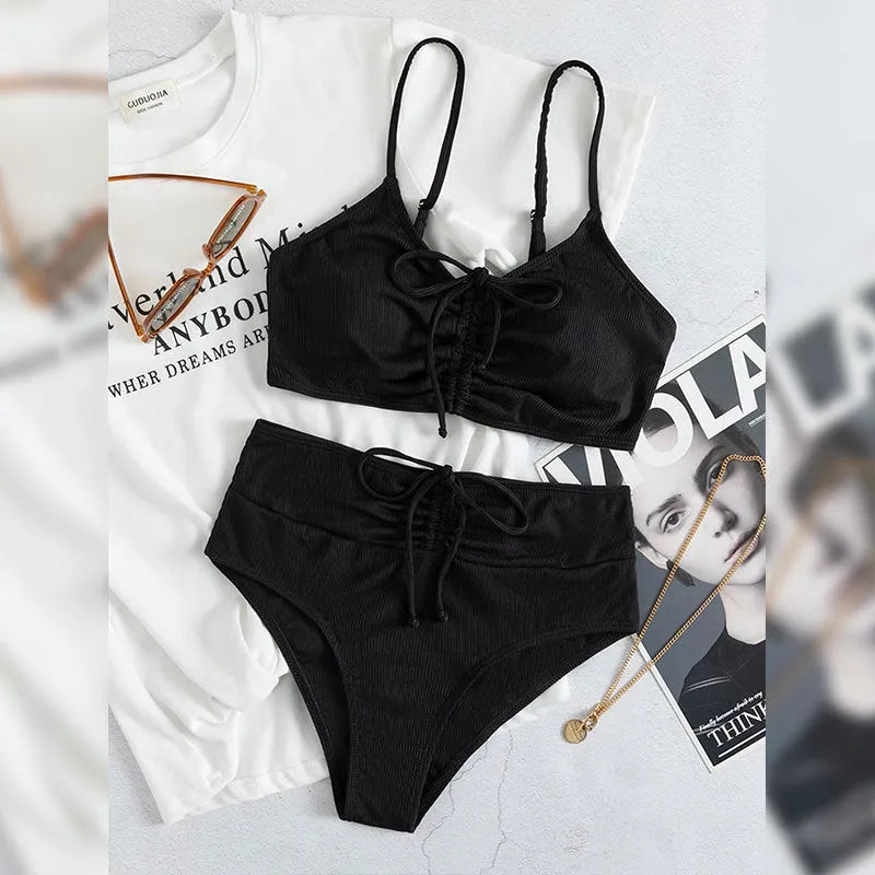 Black women's bikini swimsuit with sling split high waist design and matching shorts