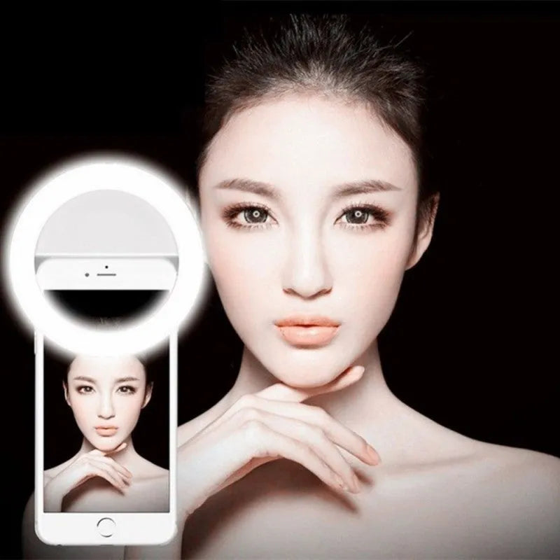 Selfie ring light clip with LED bulbs attached to mobile phone for low-light photography