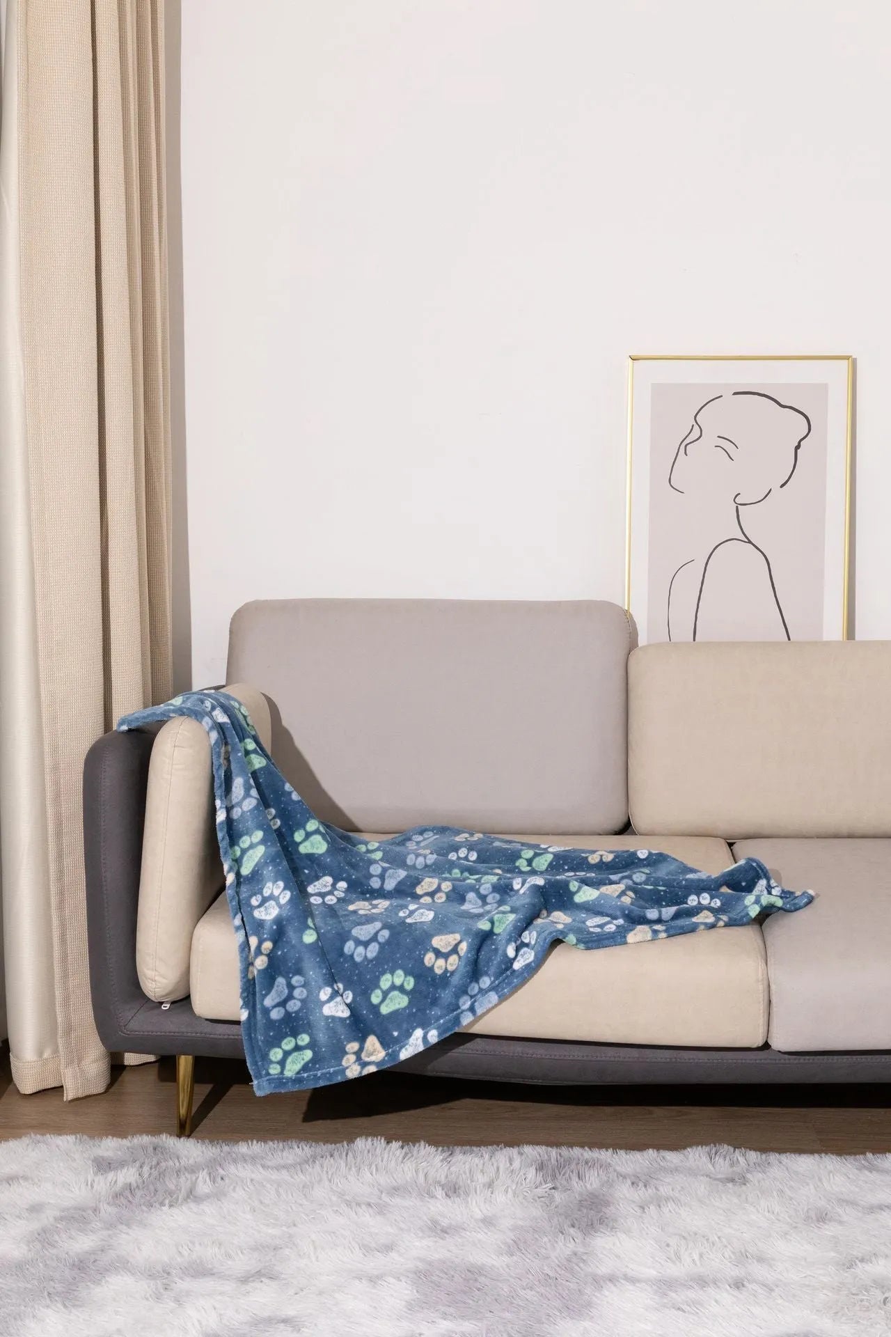 Blue cartoon dog print double-sided flannel pet blanket laid flat.