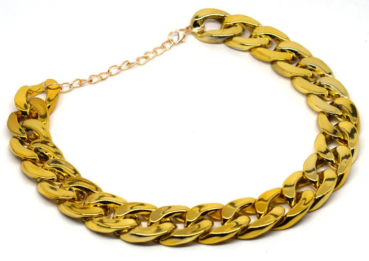 Geometric shaped gold colour dog collar with chain links and buckle on a white background.