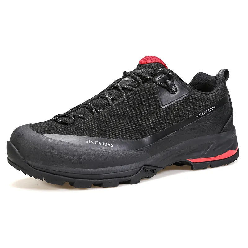 Men's low-top leather mesh hiking boots in black with non-slip rubber sole and lace-up front.
