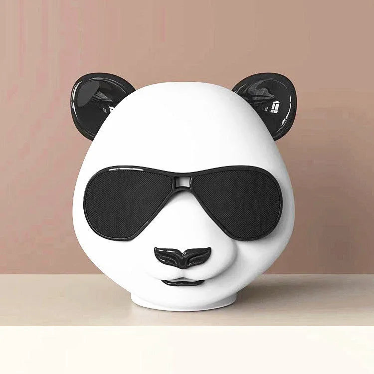 Portable mini Bluetooth speaker in classic style, showing front grill and likely a USB port.