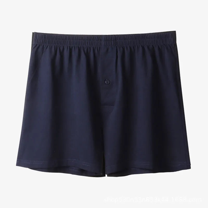 Men's loose-fit pure cotton boxer shorts in light grey, shown laid flat to display high-waist design.