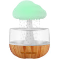 White cloud-shaped humidifier with changing colour lights and water drop display for essential oil diffusion