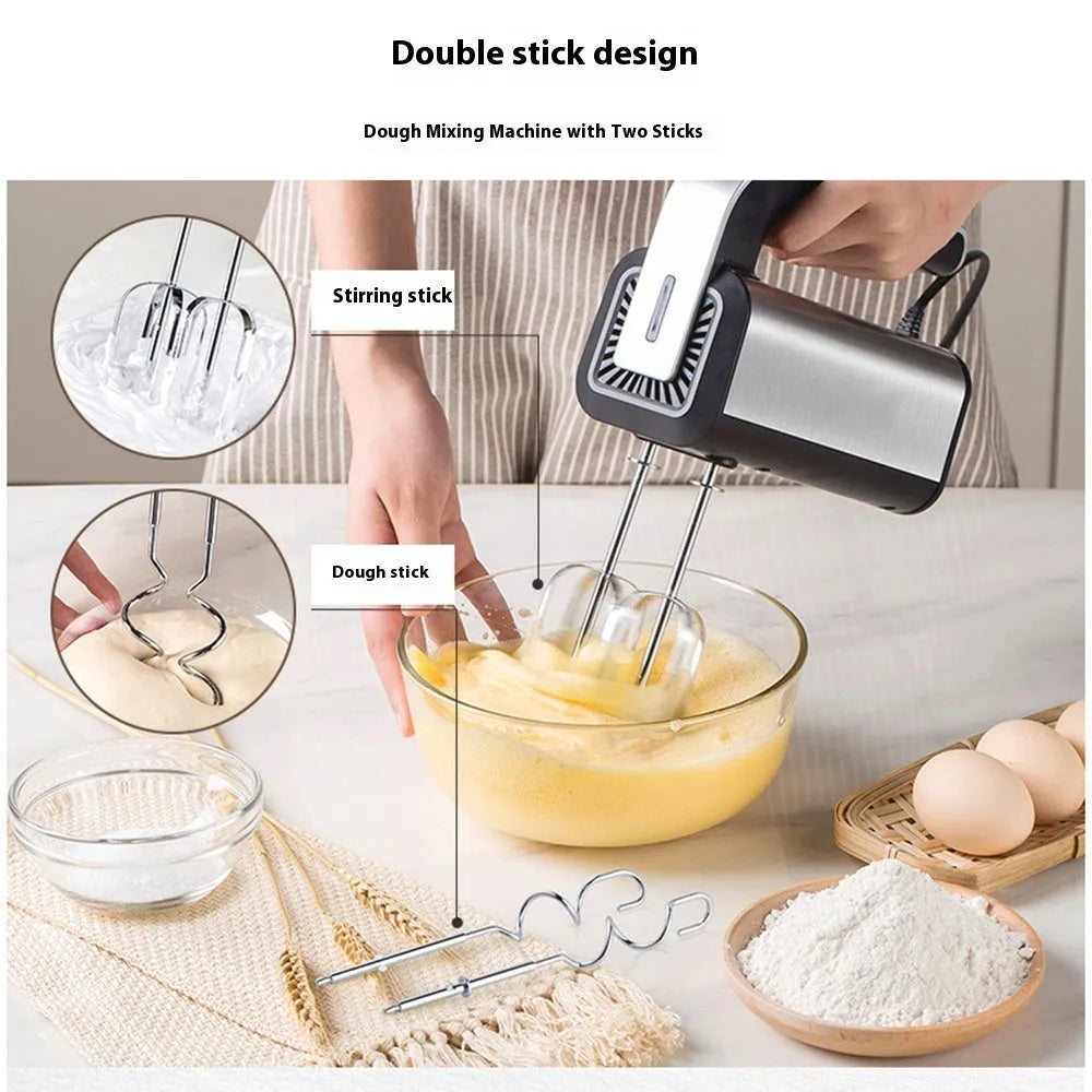 Silver handheld mini electric mixer with stainless steel beaters on a 5-speed dial.
