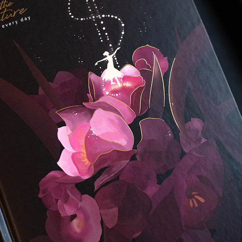A5 notebook with luminous cover open to show colour illustrated pages, in Purple colour option.