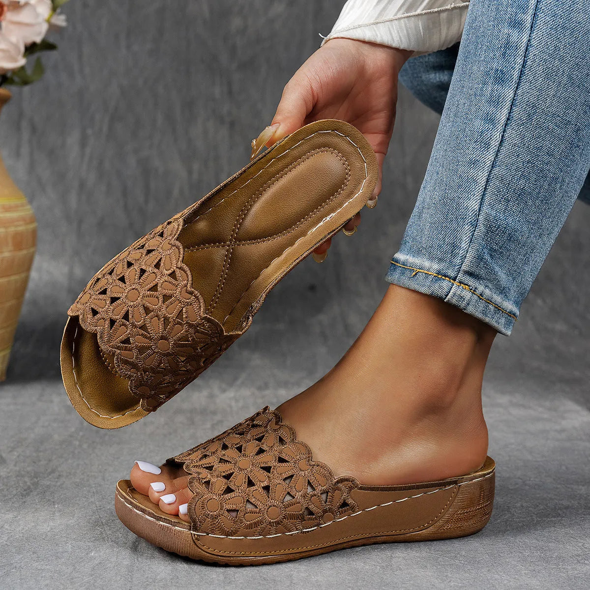 Women's floral cutout wedge beach slippers in black, blue, khaki, or light brown with PVC upper and rubber sole